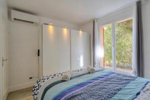 Ένα ή περισσότερα κρεβάτια σε δωμάτιο στο Havre de paix à deux pas du centre ville et de la plage