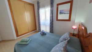 Łóżko lub łóżka w pokoju w obiekcie Rico Apartaments Ricosol