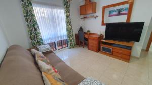 Telewizja i/lub zestaw kina domowego w obiekcie Rico Apartaments Ricosol