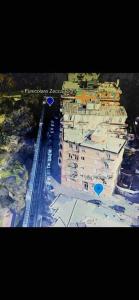 an overhead view of a building with blue circles on it at Castelletto - Appartamento+P. Auto : La Funicolare in Genova
