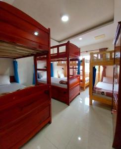 a room with four bunk beds in a house at Cam Ly Homestay in Da Lat