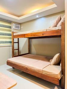 a couple of bunk beds in a room at Kâyumanggi Studio in El Nido