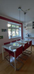 a dining room with a white table and chairs at Exceptional short-term rental in Düsseldorf