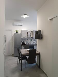 A cozinha ou kitchenette de Orchidea Home