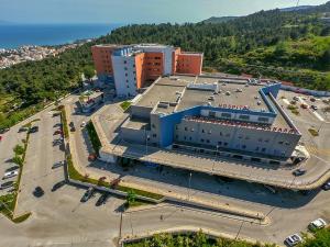 an overhead view of a large building with a parking lot at Philoxenia in Kavála