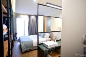 Postel nebo postele na pokoji v ubytování Thalassa Apart Hotel