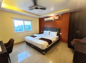 a bedroom with a large bed in a room at Royal View Residency in Bodh Gaya