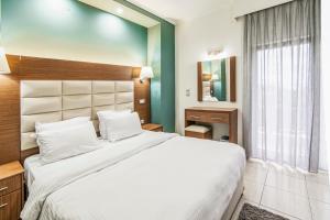 Postel nebo postele na pokoji v ubytování Thalassa Apart Hotel