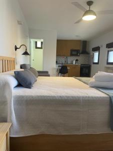 a large bed with two pillows on top of it at APARTAMENTO RURAL LA CANDELARIA in Elche de la Sierra