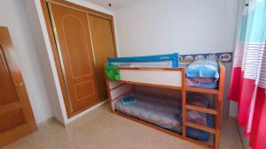 Łóżko lub łóżka w pokoju w obiekcie Rico Apartaments Ricosol