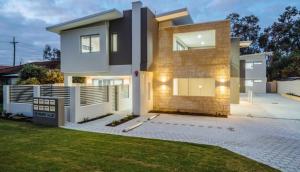 a modern house with a fence in a yard at 2 Conveniently Quiet Cloverdale 2brpark in Perth
