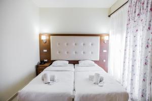 Postel nebo postele na pokoji v ubytování Thalassa Apart Hotel
