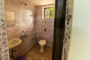Um banheiro em BlueLine Holiday Homes