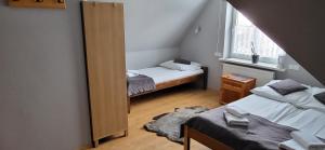 Postel nebo postele na pokoji v ubytování Willa Nad Białką