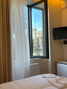 Postel nebo postele na pokoji v ubytování Bina N28