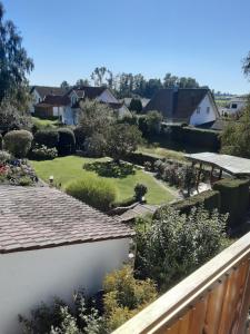 a view of a garden from the balcony of a house at FeWo Christine in Bad Buchau