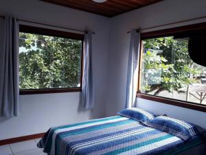 Postel nebo postele na pokoji v ubytování Casa Mar - Beira mar na Ilha do Araújo - Paraty