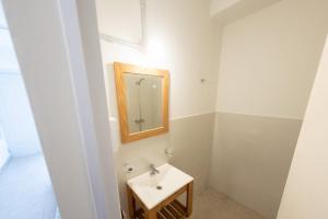 a bathroom with a sink and a mirror at Petit apart in Villa María
