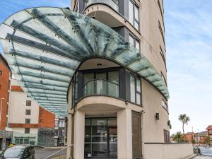 a building with a glass dome on the side of it at Apartment 13 in Swansea