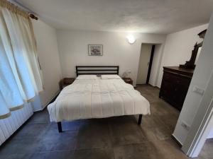 Posteľ alebo postele v izbe v ubytovaní Appartamenti Bice Abetone 1