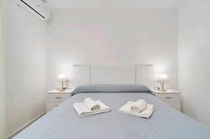 フリヒリアナにあるLa casita de Sergioのベッドとタオル2枚のある寝室 +27枚の写真