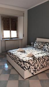 Säng eller sängar i ett rum på Appartamento La casa di Nica