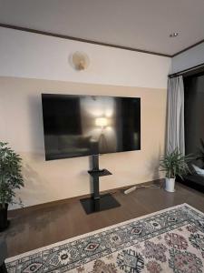 TV a/nebo společenská místnost v ubytování Daiju Myoko