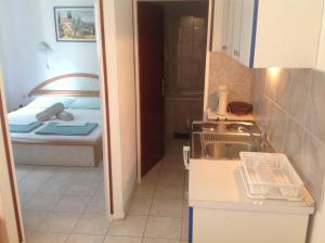 Llit o llits en una habitació de Apartment Kordić