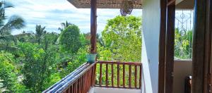 a balcony with a view of the forest at Villa de Flora Zanzibar 