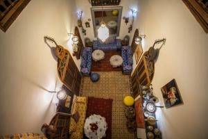an overhead view of a living room with clocks at Riad Les Idrissides Chez LEA in Fez
