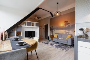 a living room with a couch and a table at Appartementen het Waterhoentje in Sint Jansklooster
