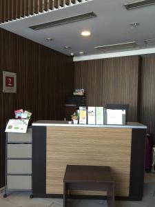 an office with a reception desk with a counter at R&B Hotel Tokyo Toyocho in Tokyo