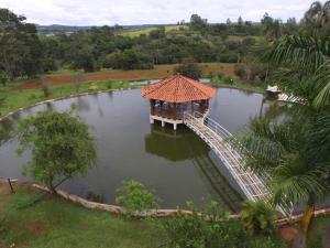 a bridge in the middle of a body of water at RECANTO OJAMA in Abadiânia