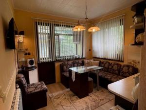 a living room with a table and a couch at Z-apartment in Tryavna in Tryavna