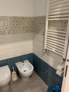 a bathroom with a toilet and a bidet at B&B La Paranza in Corigliano Calabro