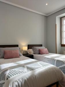 מיטה או מיטות בחדר ב-Arotzetxea
