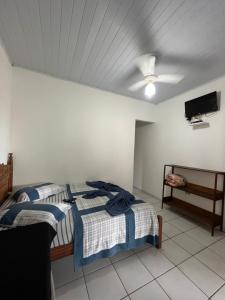 Un pat sau paturi într-o cameră la Pouso da Celeste - Trindade