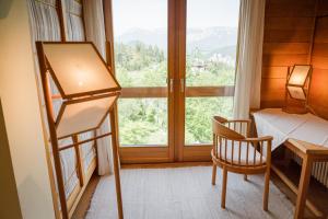 Postel nebo postele na pokoji v ubytování Panoramahotel Wagner - Das Biohotel am Semmering