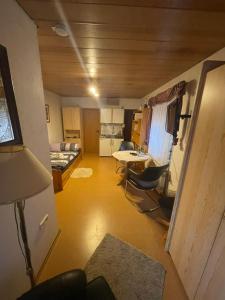 a room with a bed and a table and chairs at Ferienwohnung Hoffmann in Bad Münder am Deister