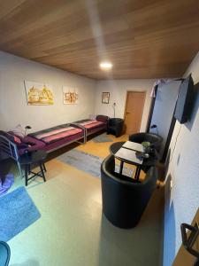a living room with a bed and a couch at Ferienwohnung Hoffmann in Bad Münder am Deister