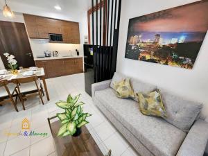 a living room with a couch and a table at 3 Bedroom Corner Panoramic View in Davao City