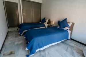 Кровать или кровати в номере bel appartement au cœur de Gueliz