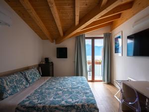 Postel nebo postele na pokoji v ubytování Foresteria Lago di Como + 114 fotografií