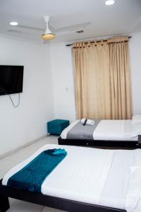Postel nebo postele na pokoji v ubytování SGH Rodadero Suites