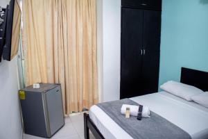 Postel nebo postele na pokoji v ubytování SGH Rodadero Suites