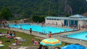 a group of people in a swimming pool at Louer à la montagne in Saint-Béat