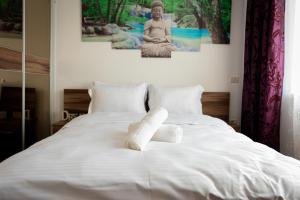 Postel nebo postele na pokoji v ubytování CH Apartments Coresi