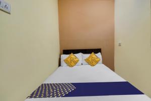 Postel nebo postele na pokoji v ubytování SPOT ON Hotel Sai Ashirwad Residency