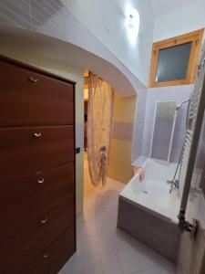 a bathroom with a sink and a toilet in a room at I ciclamini in Monopoli