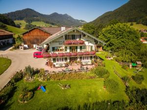 an aerial view of a house with a garden at Schneider-Hof in Ruhpolding
